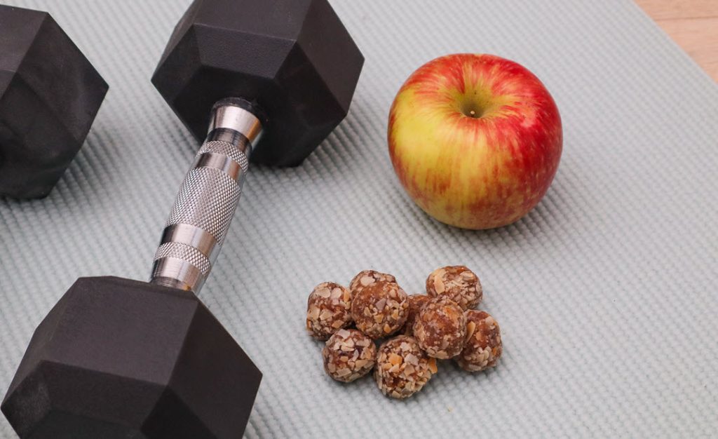 YEU energy balls with an apple and a dumbbell
